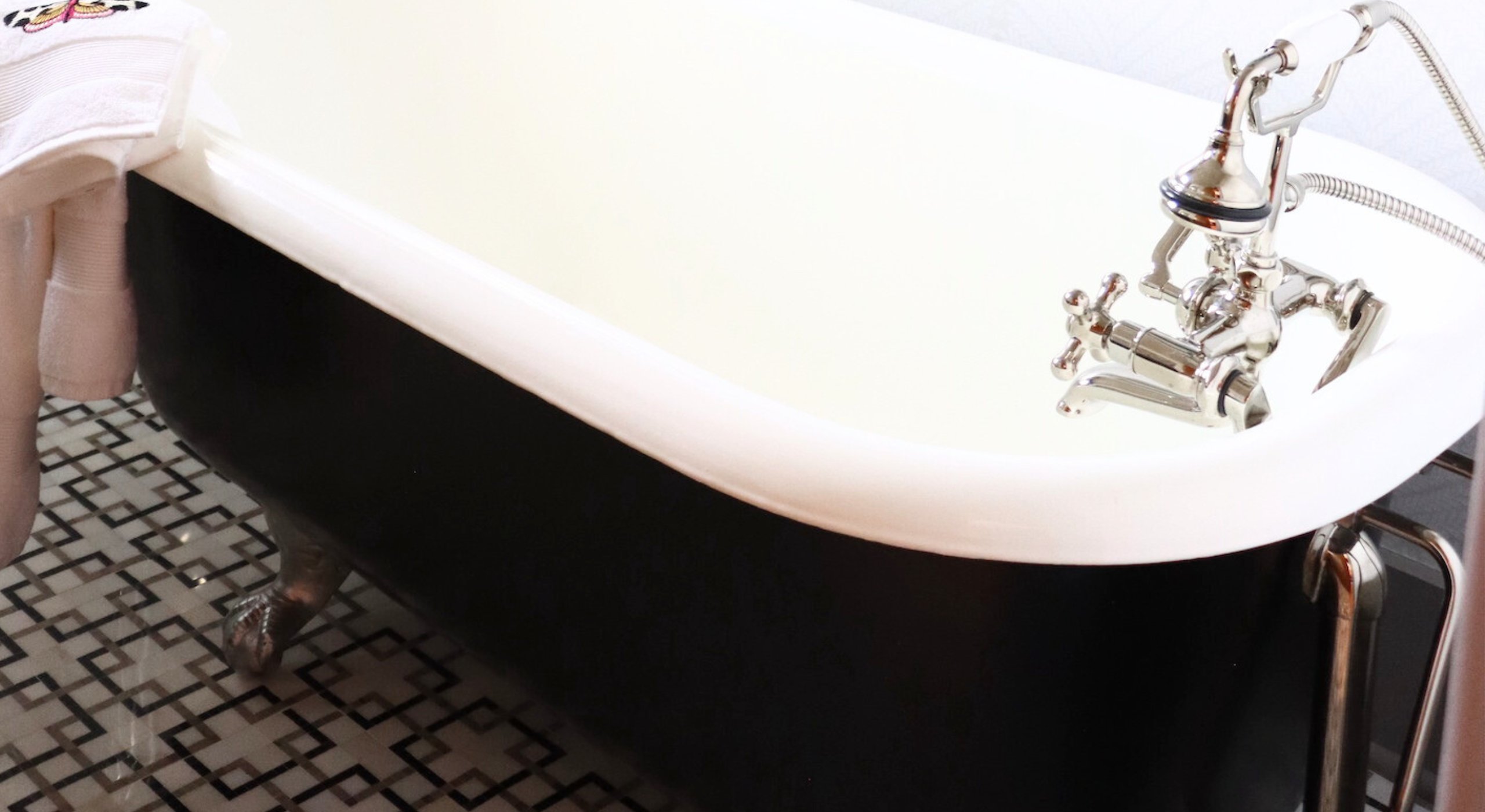 Elegant powder bath with couture textures and refined details in Le Dolce Couture Retreat, Papillion, Nebraska.