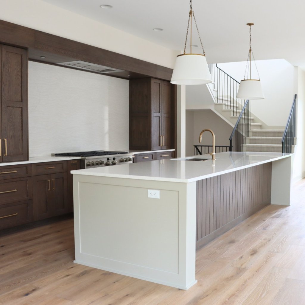 Main level interior kitchen of custom Elkhorn home featuring designer finishes and natural light.