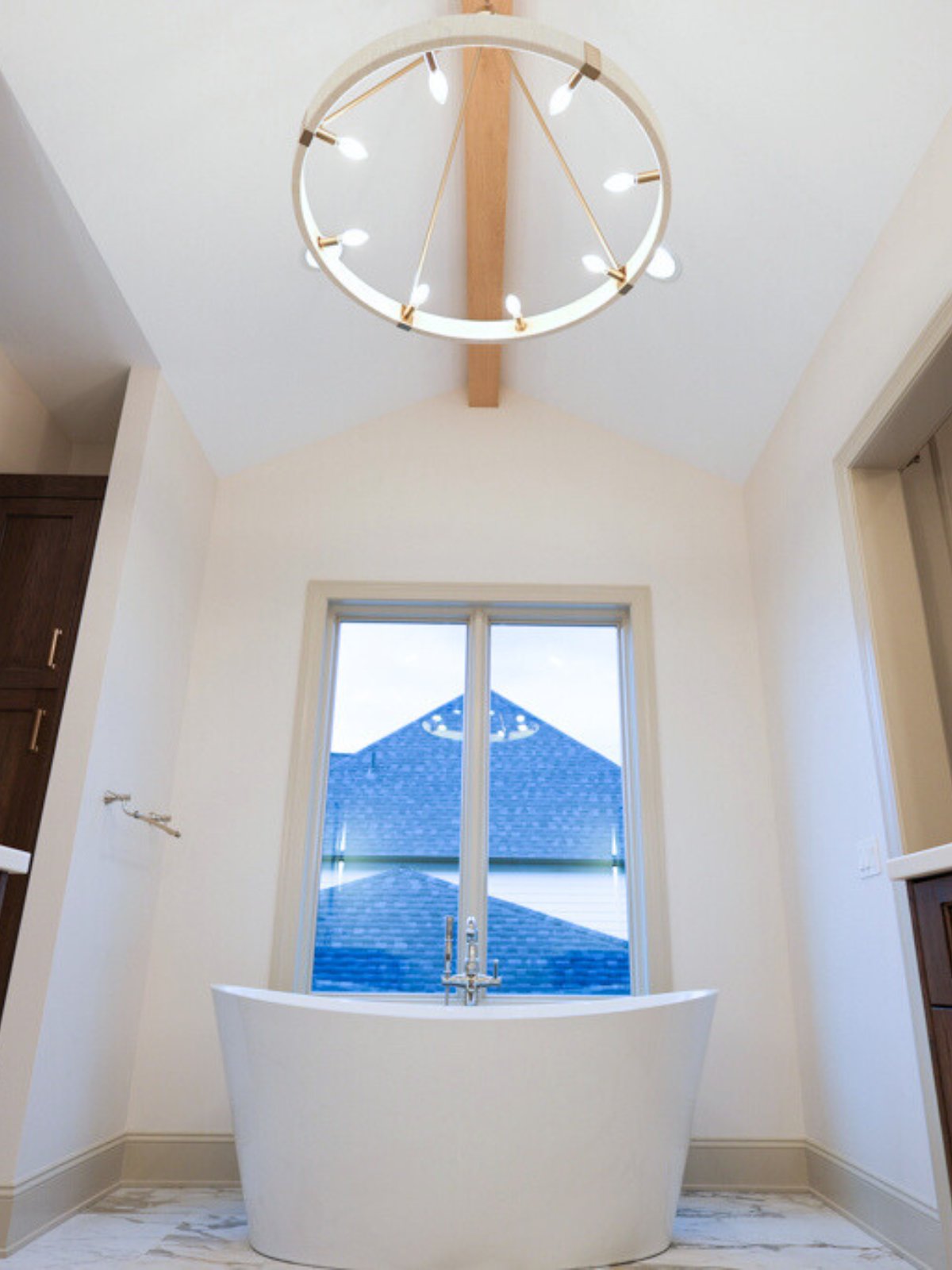 Chandelier in primary bathroom of custom Elkhorn Ne home.