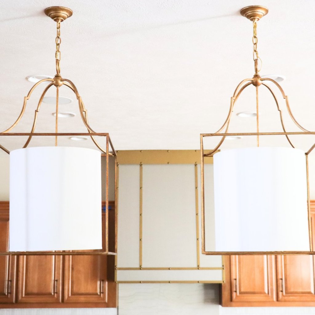 Double accent lighting in kitchen remodel. Designed by Cura and Dot Interior Designer Studio in Omaha