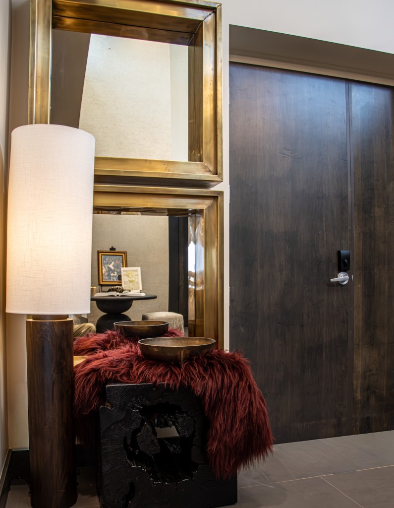 Oversized chunky mirrors and uniquely styled drop zone in a downtown Omaha condo.