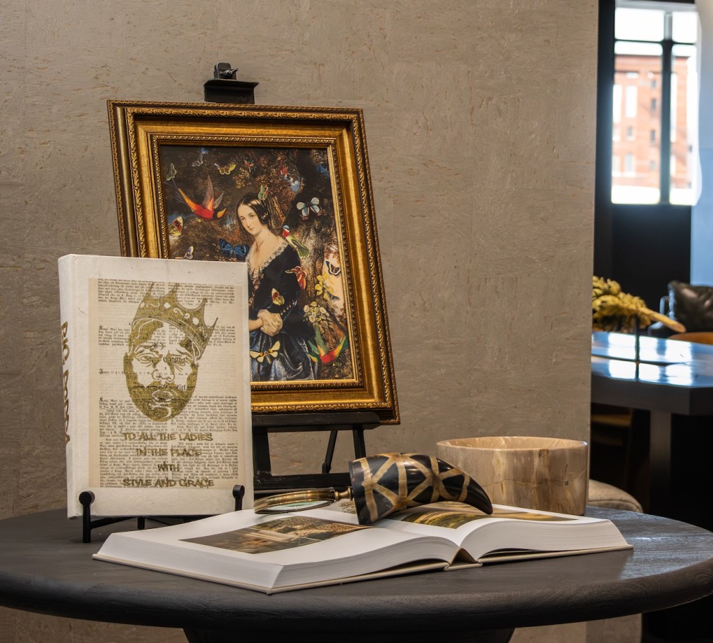 Tailored entryway vignette featuring a modern console table and edgy accents.